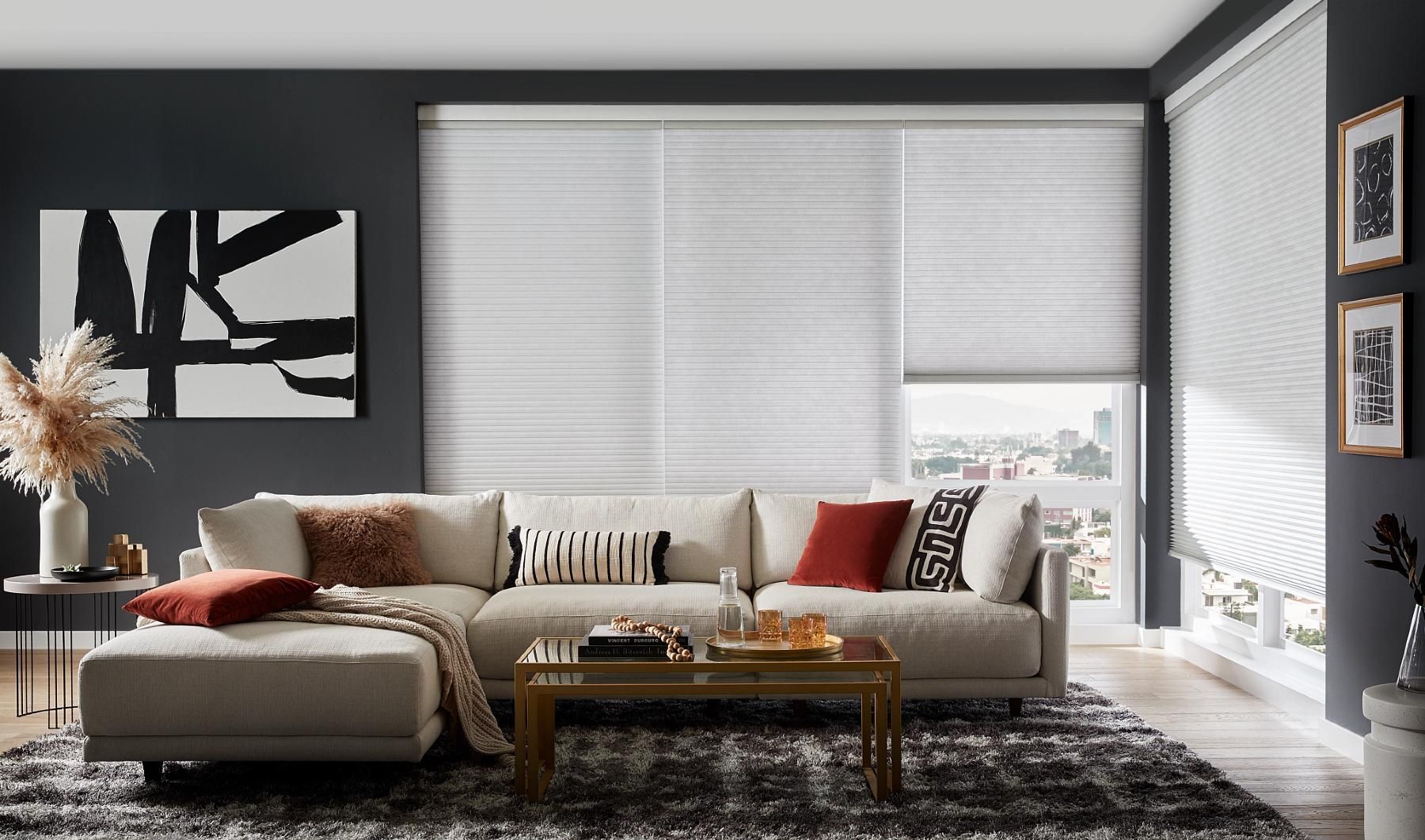 Motorized cellular shades in a modern living room with a soft fabric texture