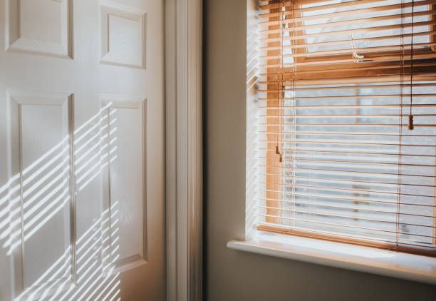 natural wood blinds installed on hallway window for privacy and warmth