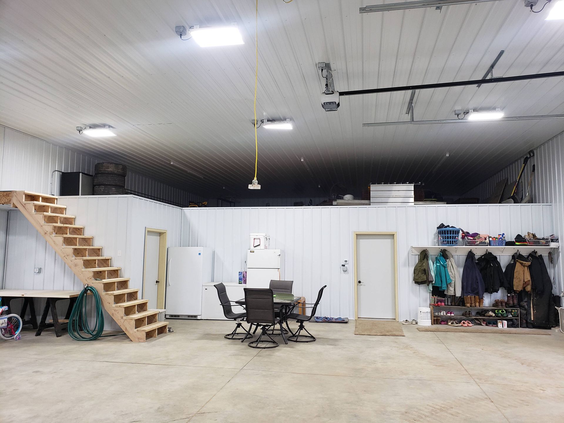 A large room with a table and chairs in it