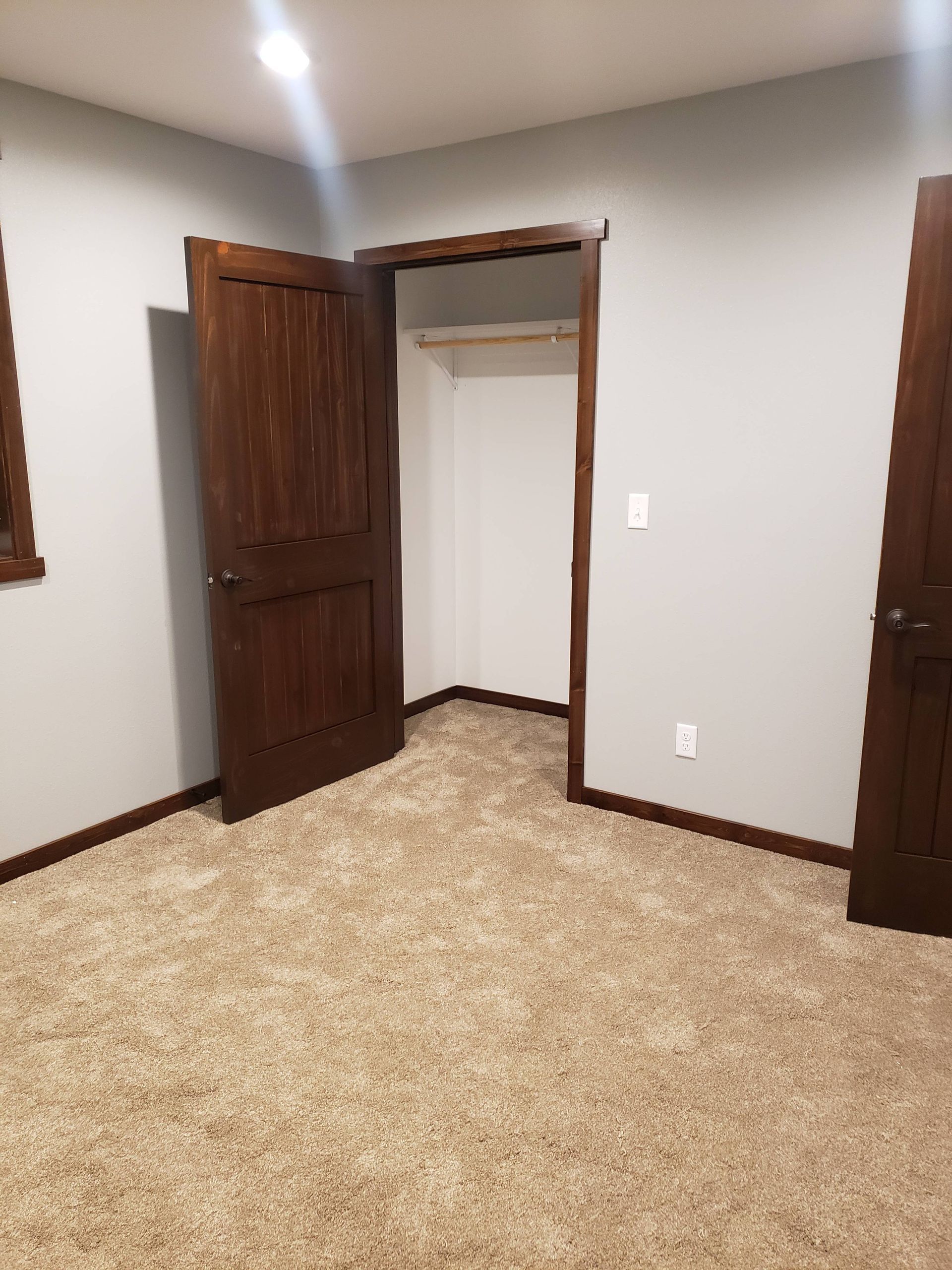 There is a closet in the corner of the room.