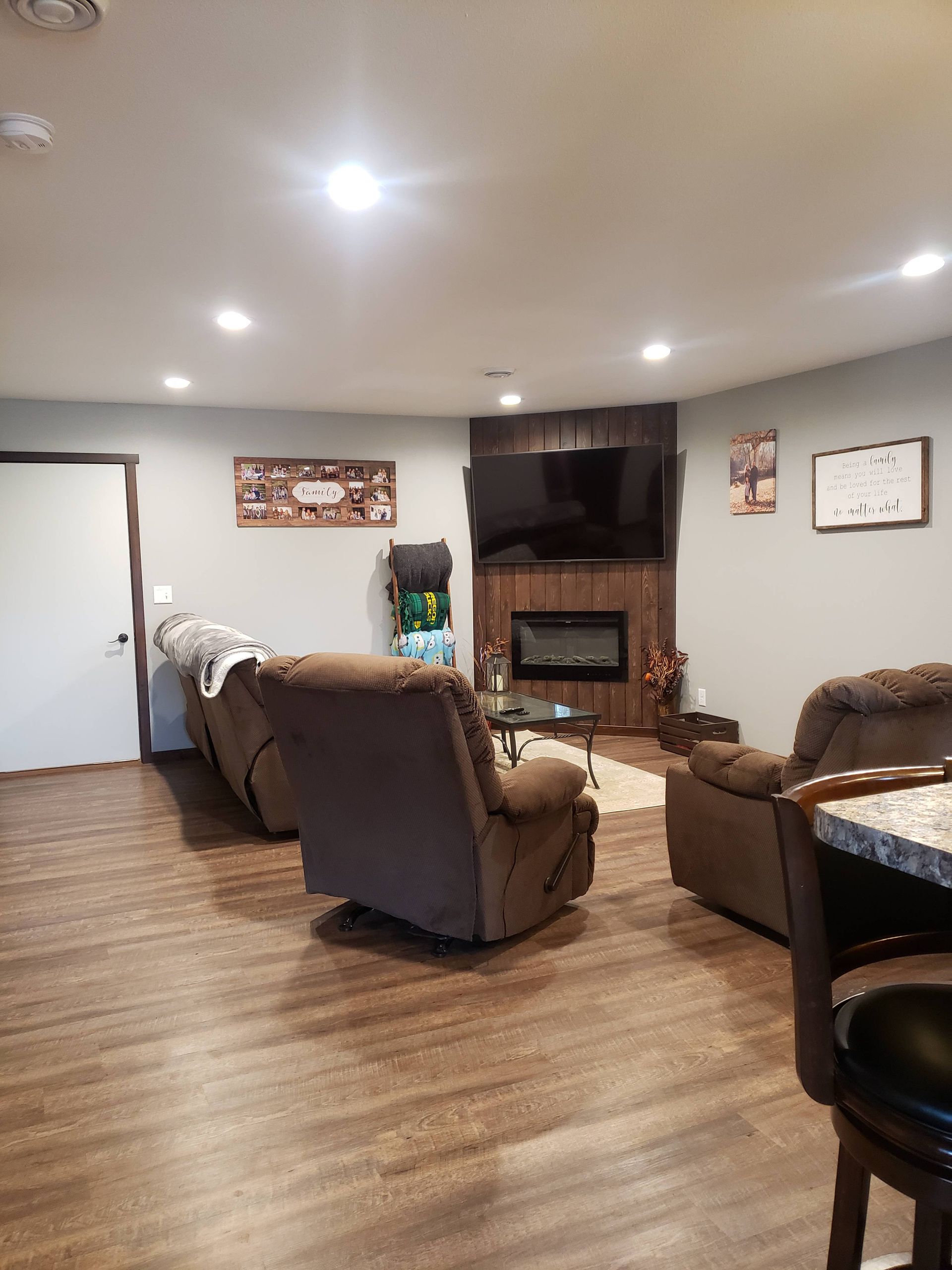 A living room filled with furniture and a fireplace.