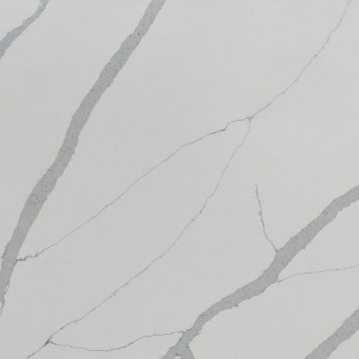 White marble surface with subtle gray veining and diagonal cracks