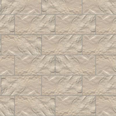 Beige stone tile wall with a textured rectangular block pattern