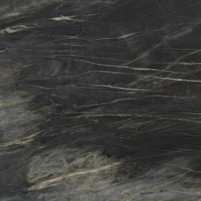 Dark gray scratched surface with a small lighter patch near the bottom left.
