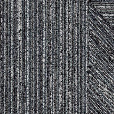 Close-up of gray woven fabric with vertical stripes and a diagonal seam detail