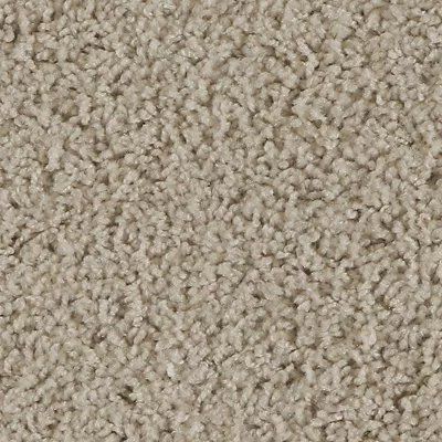 Close-up of beige textured carpet fibers