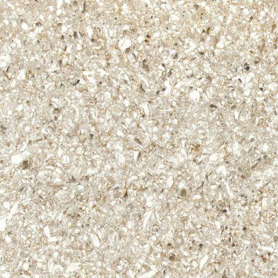 Close-up of a beige speckled stone or textured surface
