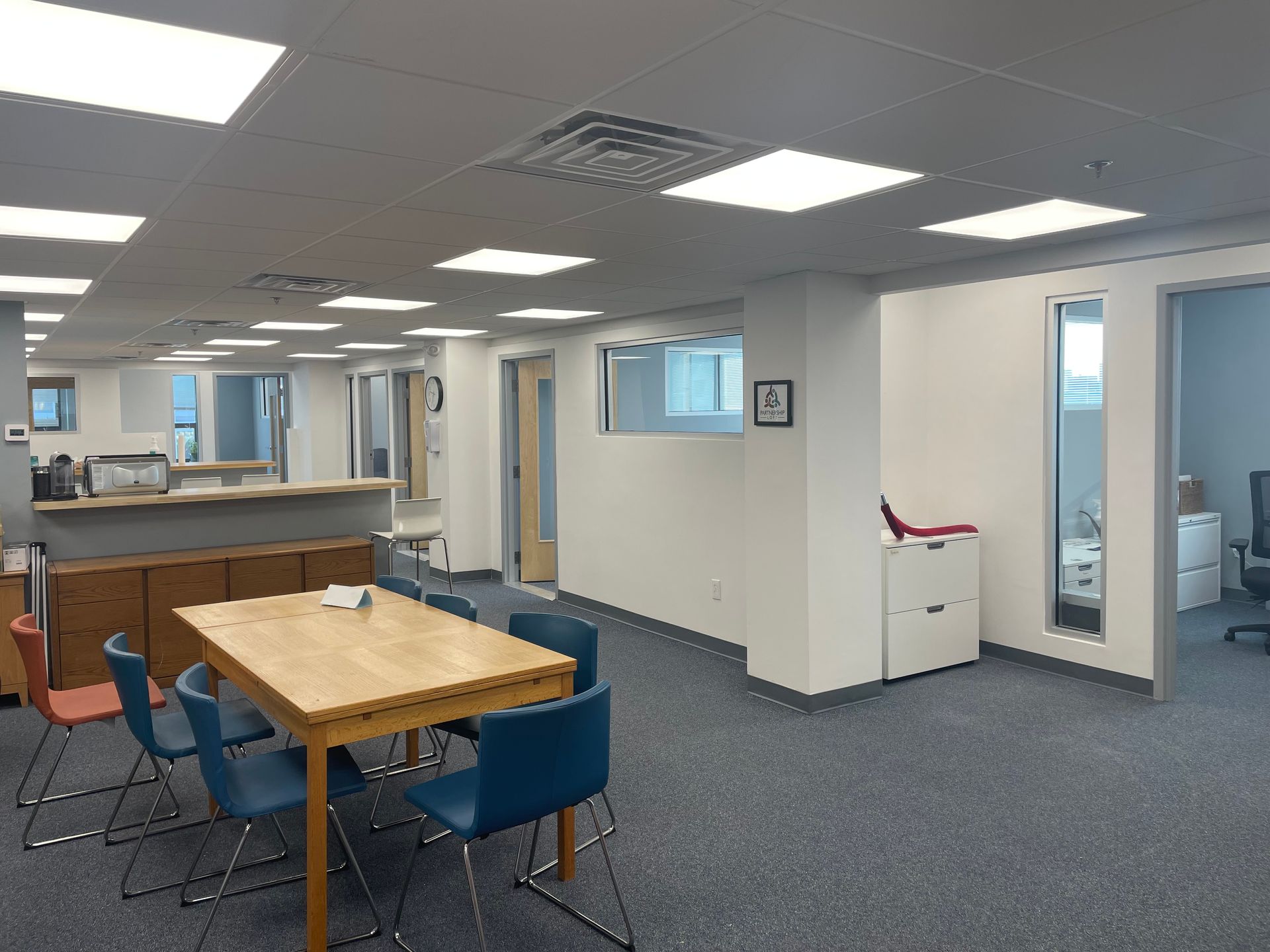 An artist 's impression of a large white building with a lot of windows.