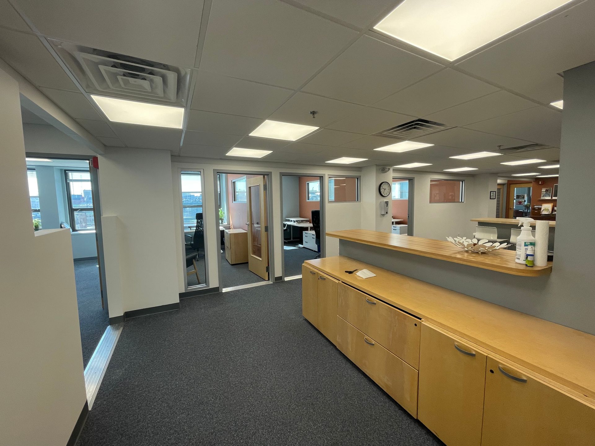 An artist 's impression of a house with a car parked in front of it.