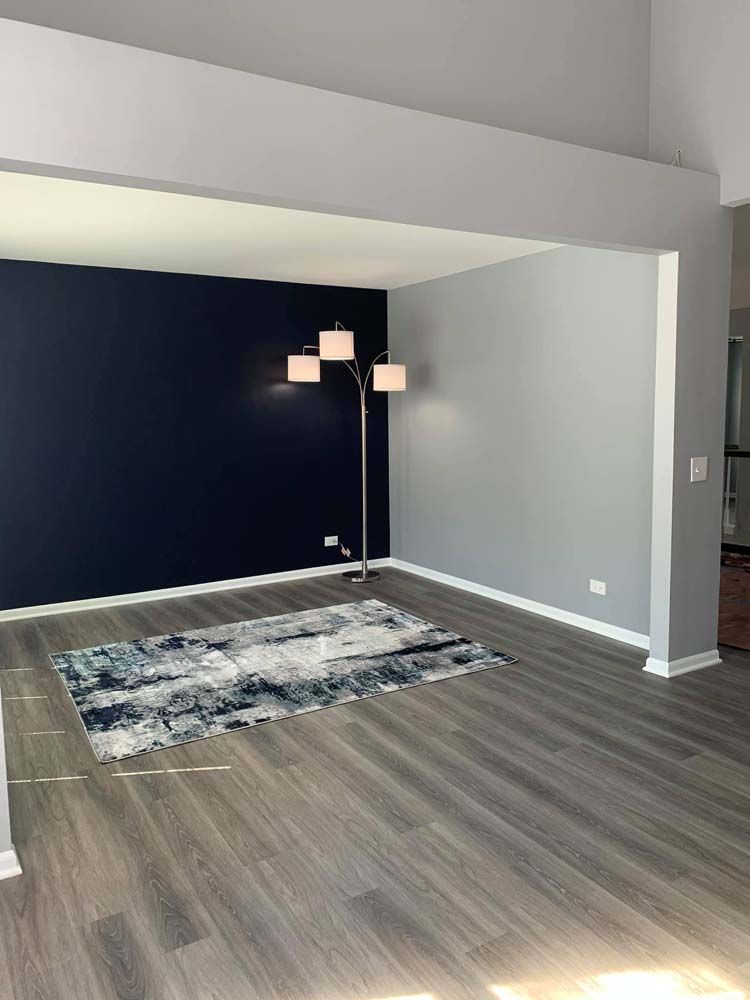 There is a rug in the middle of the living room.