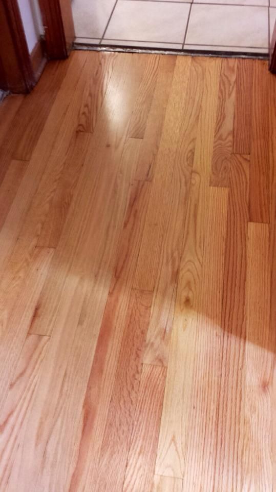 A close up of a wooden floor in a room.