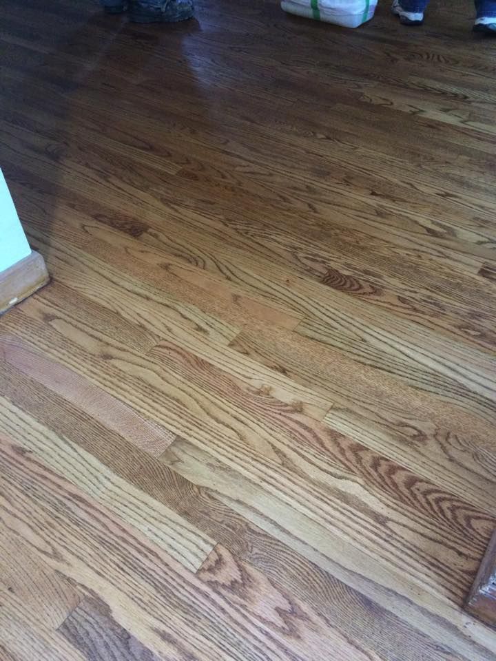 A close up of a wooden floor in a room.