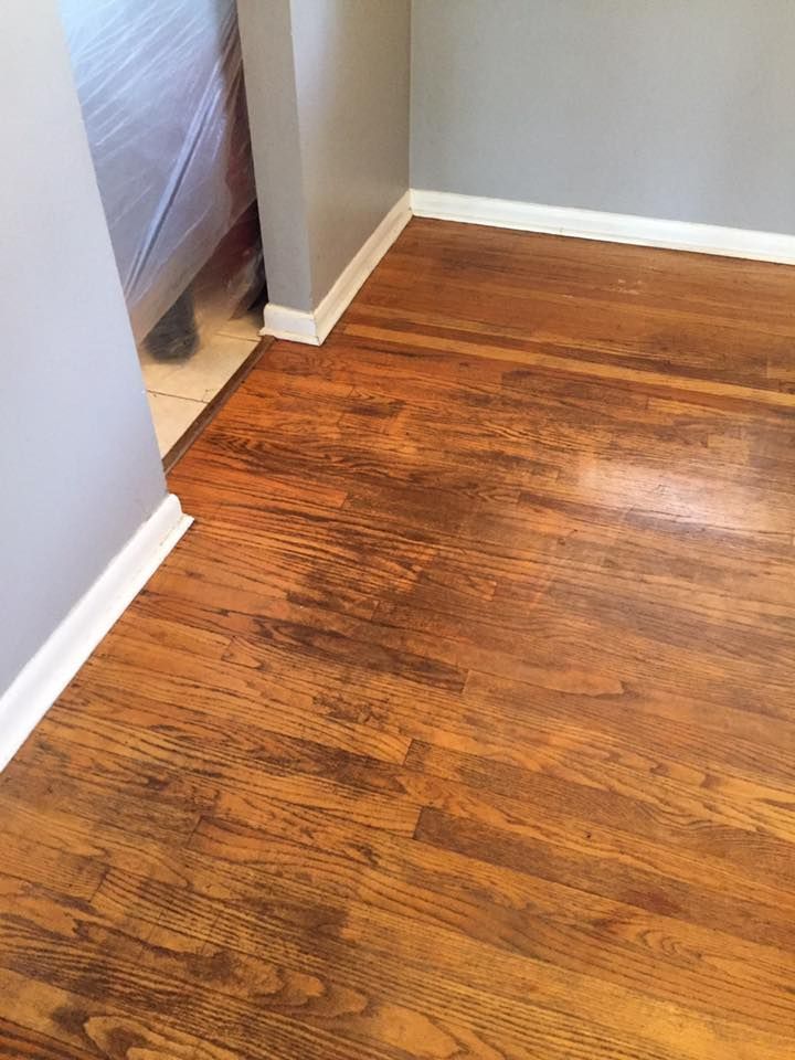A close up of a wooden floor in a room.