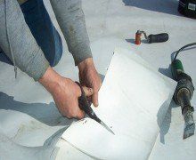 cutting-a-patch-for-roofing-repair