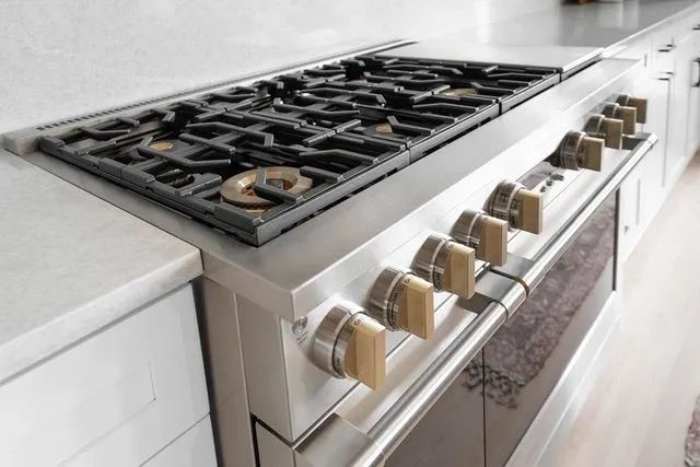 A stove top oven is sitting on top of a counter in a kitchen.