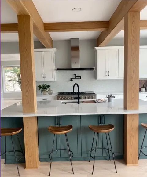 A kitchen with a stove top oven and a sink