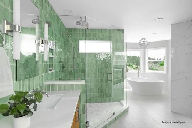 A bathroom with green tiles and a walk in shower.