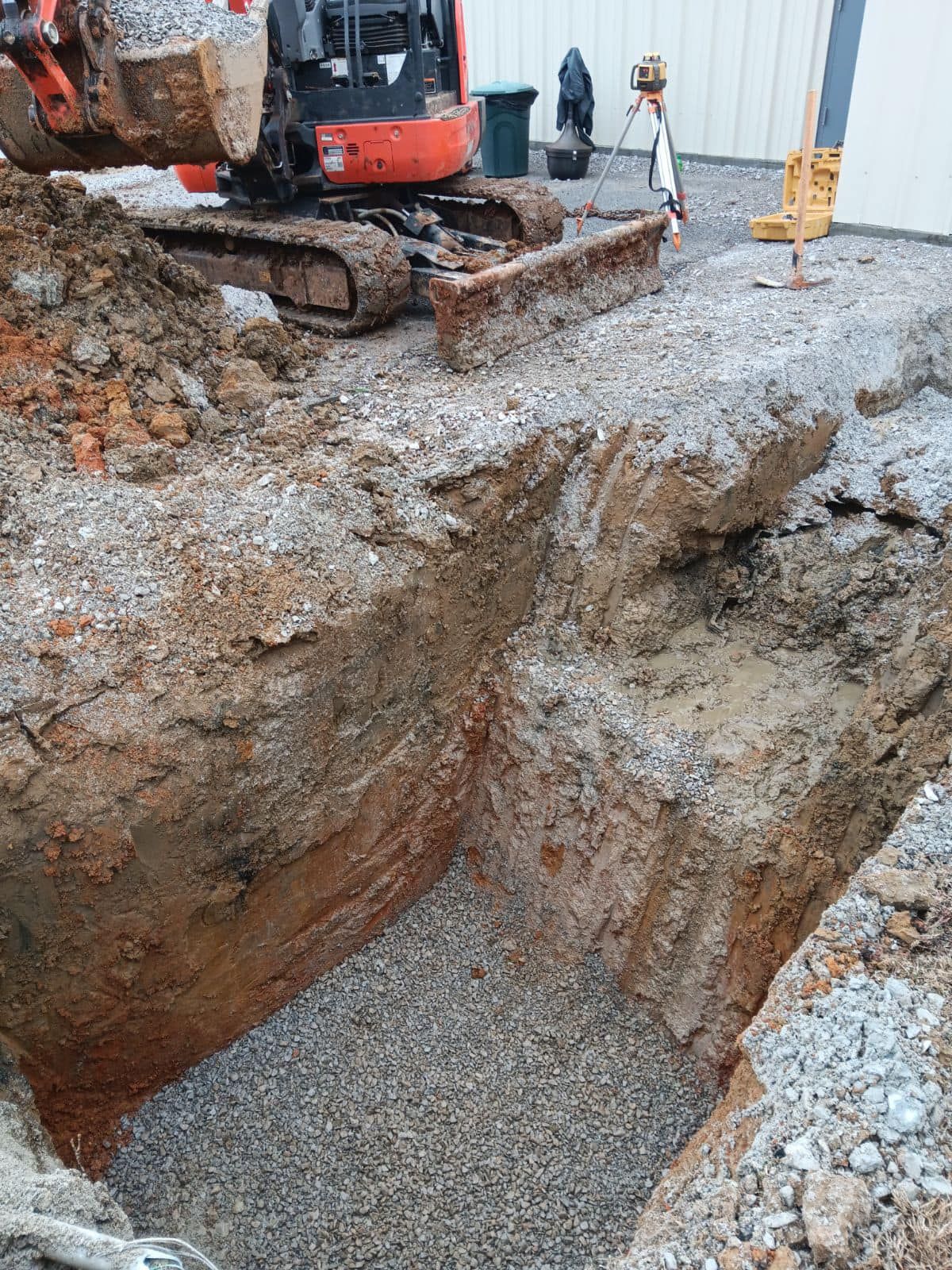 A bulldozer is digging a hole in the ground.