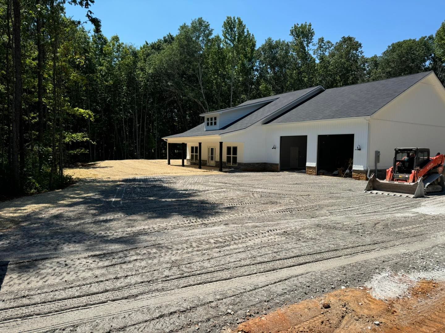 A house with a lot of dirt in front of it