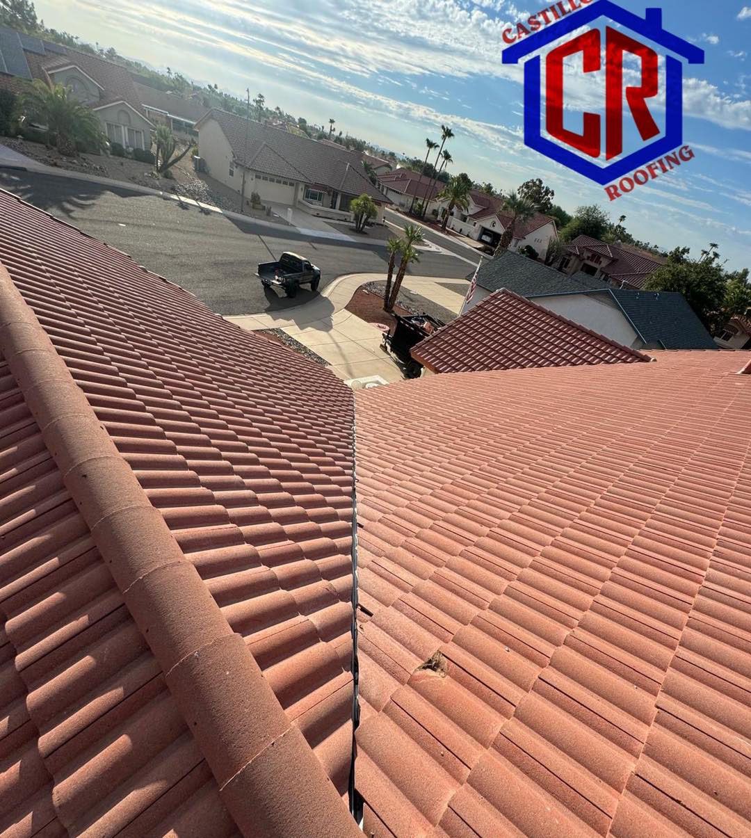 An aerial view of a roof with a cr logo on it