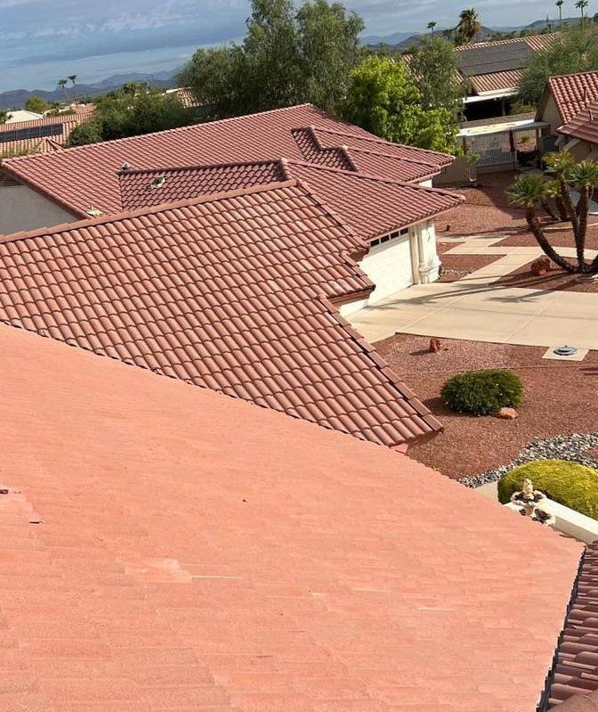 An aerial view of a house with a red tile roof.