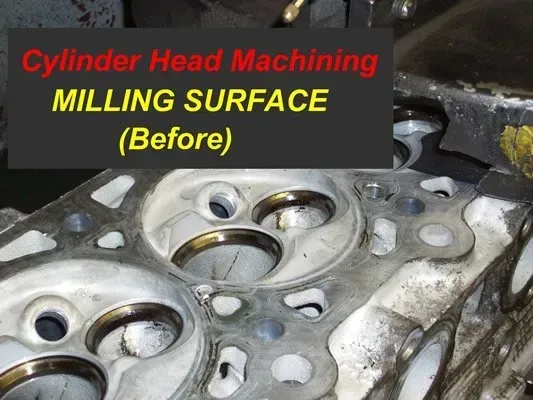 Cylinder head before milling surface. Close-up shows valves, chambers, and bolt holes in engine part.