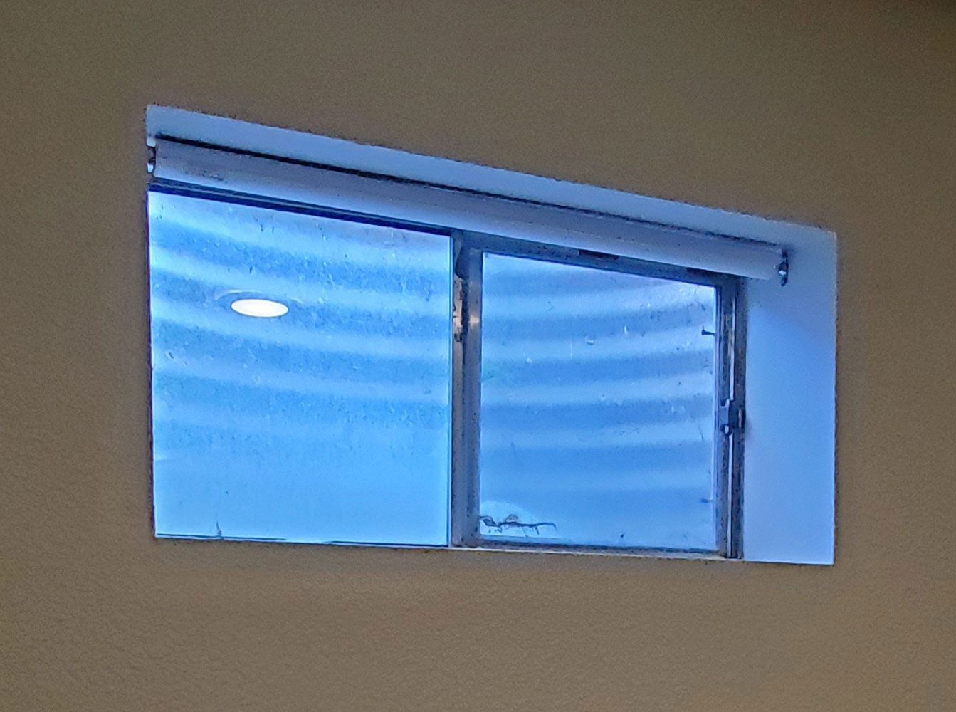 A window with a blue sky behind it