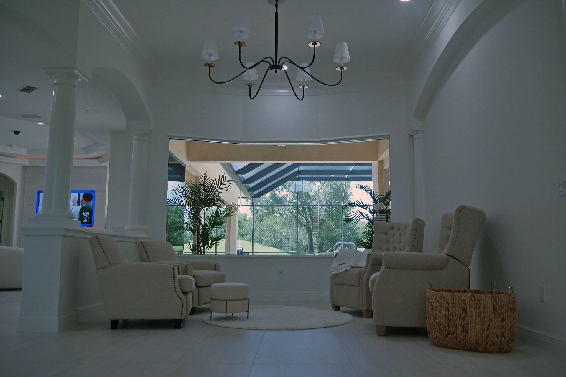 A living room filled with furniture and a chandelier