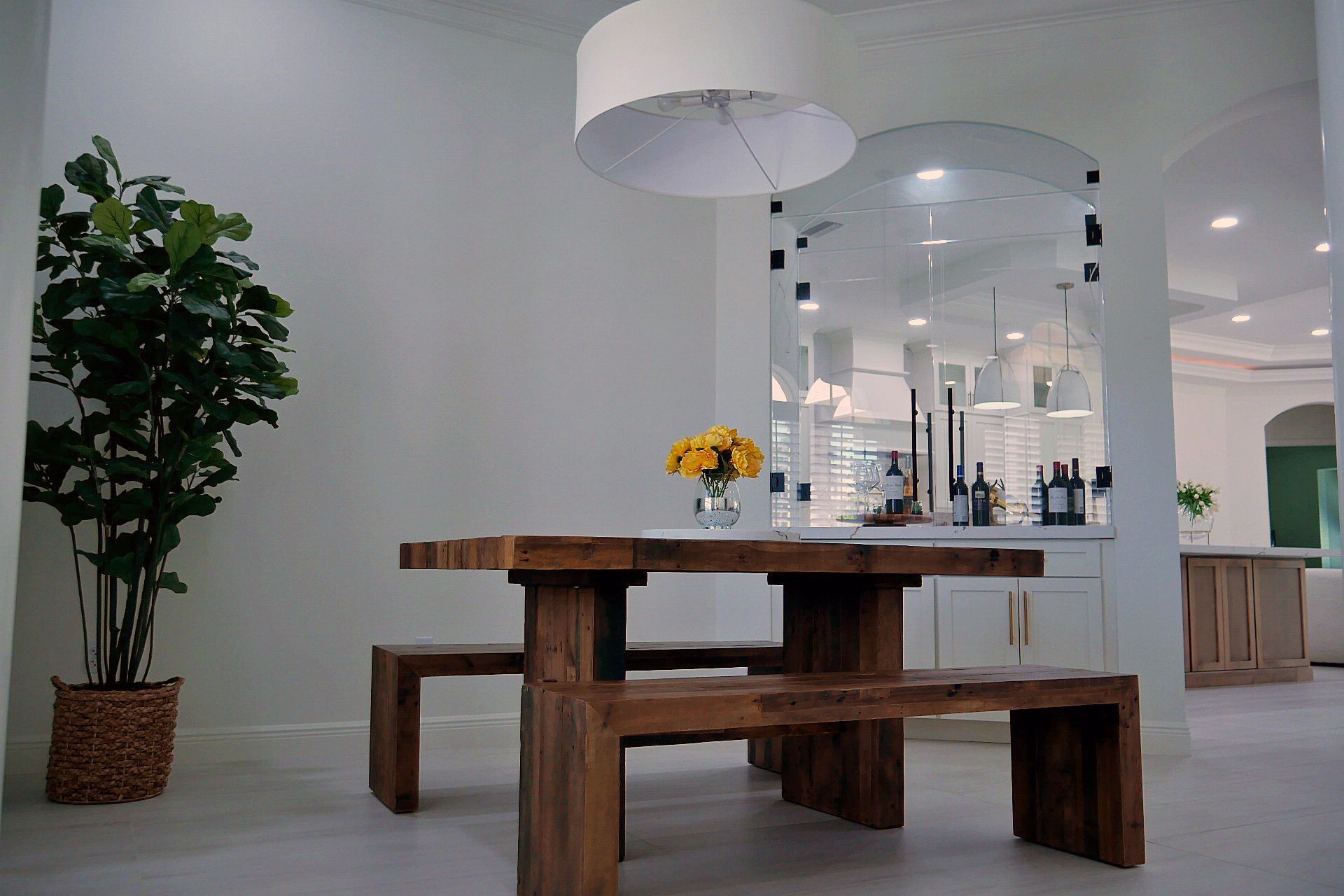 A dining room with a wooden table and benches