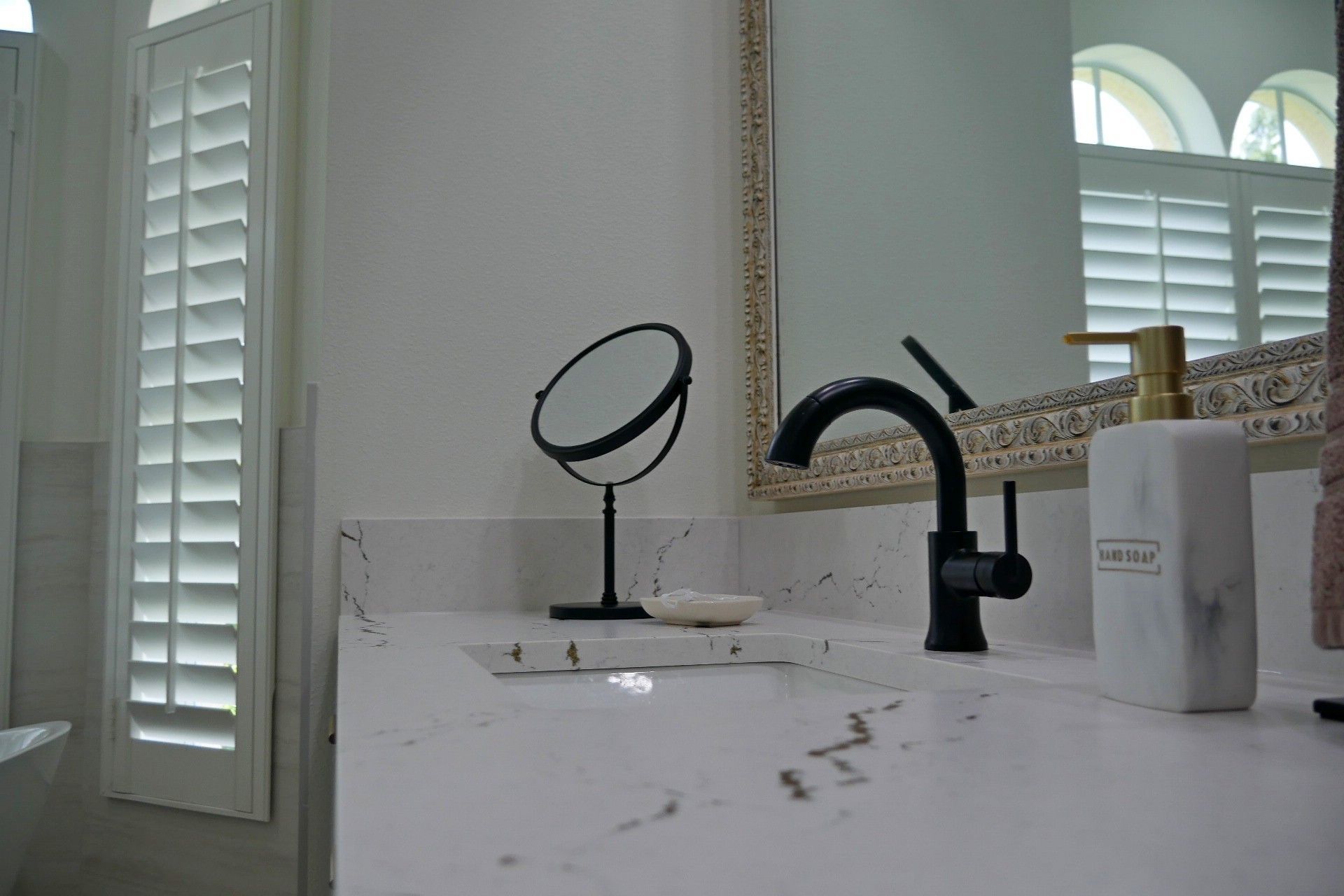 Bathroom sink with black fixtures
