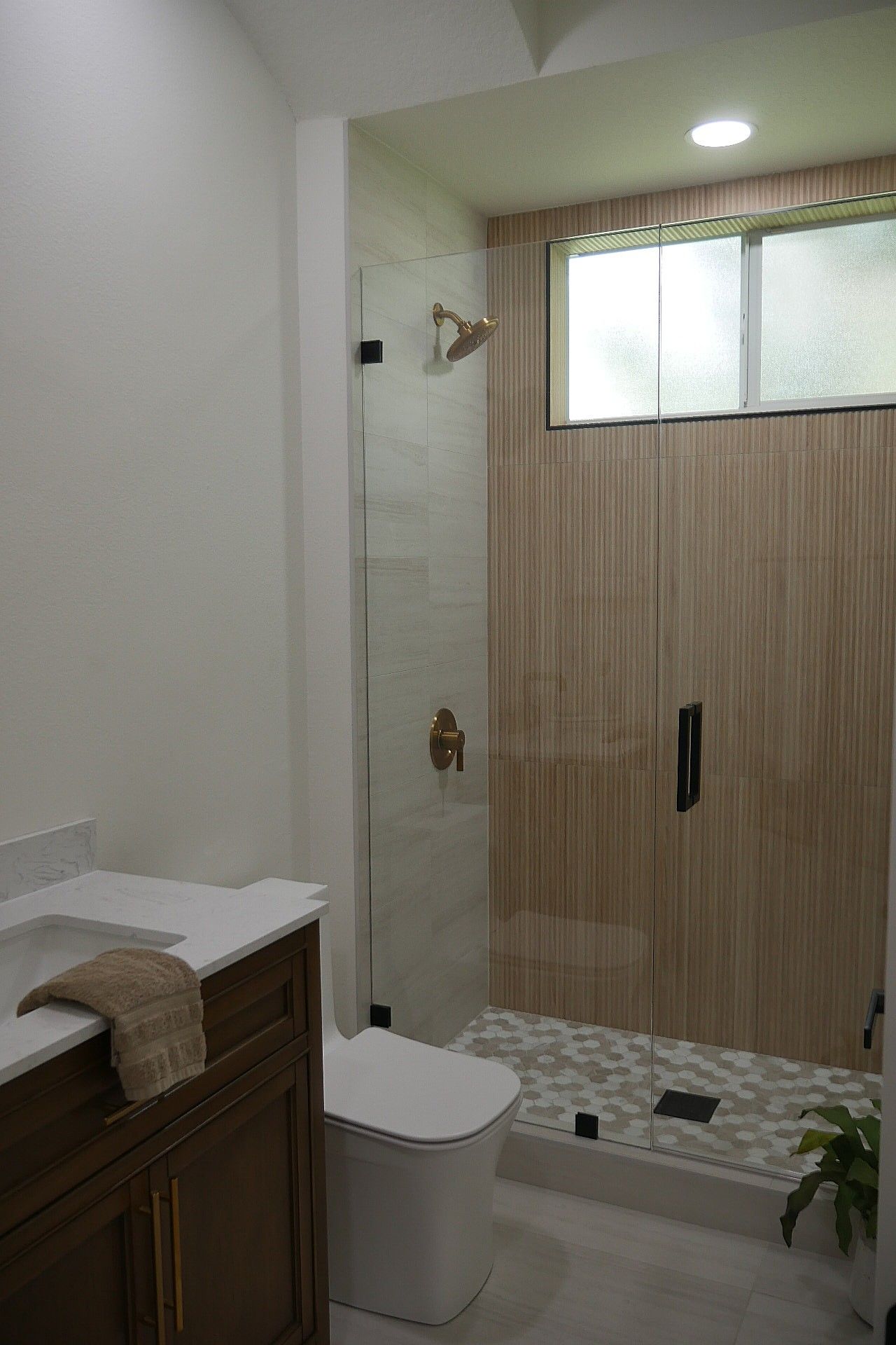 Dark green cabinets on a bathroom