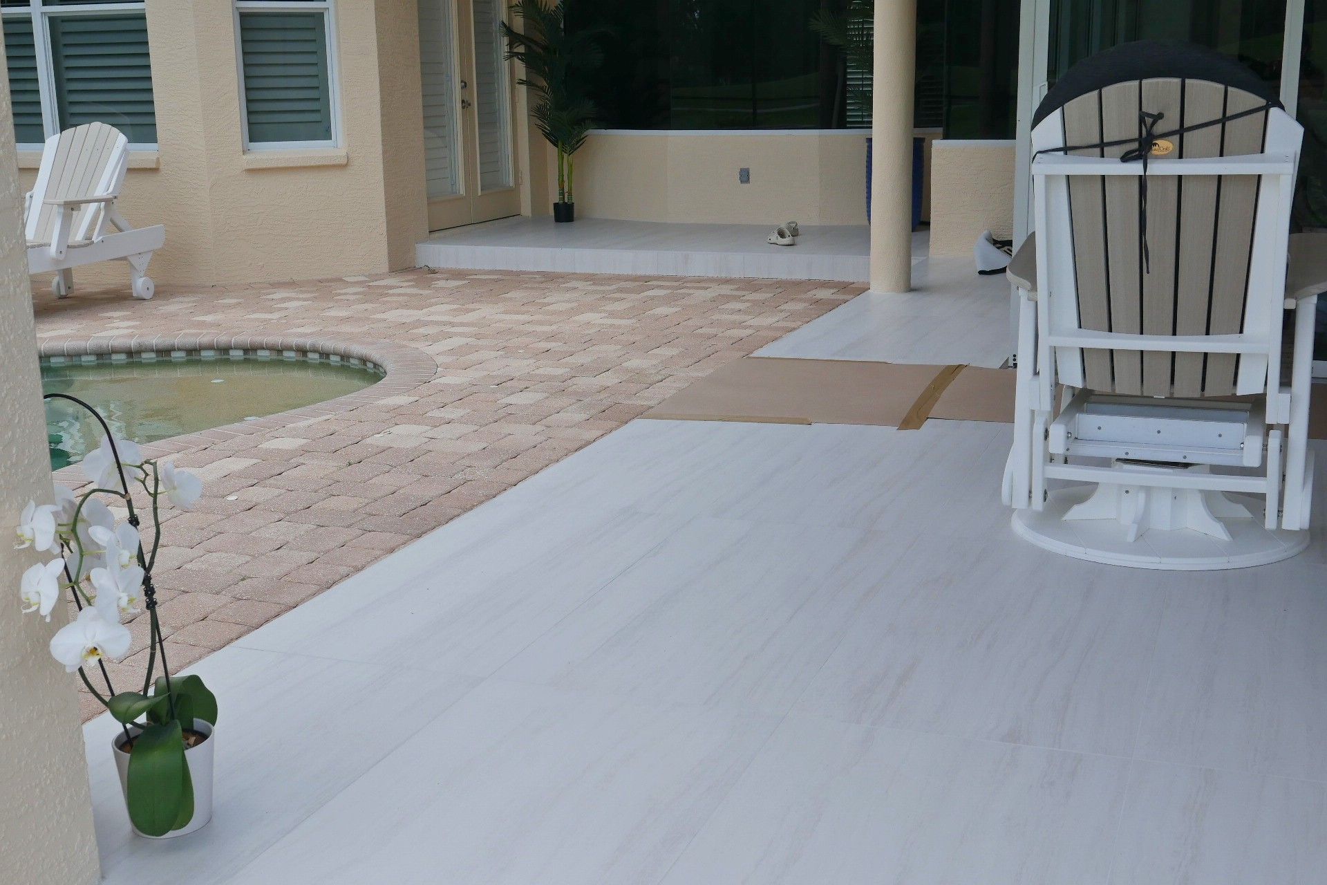 A patio with two chairs