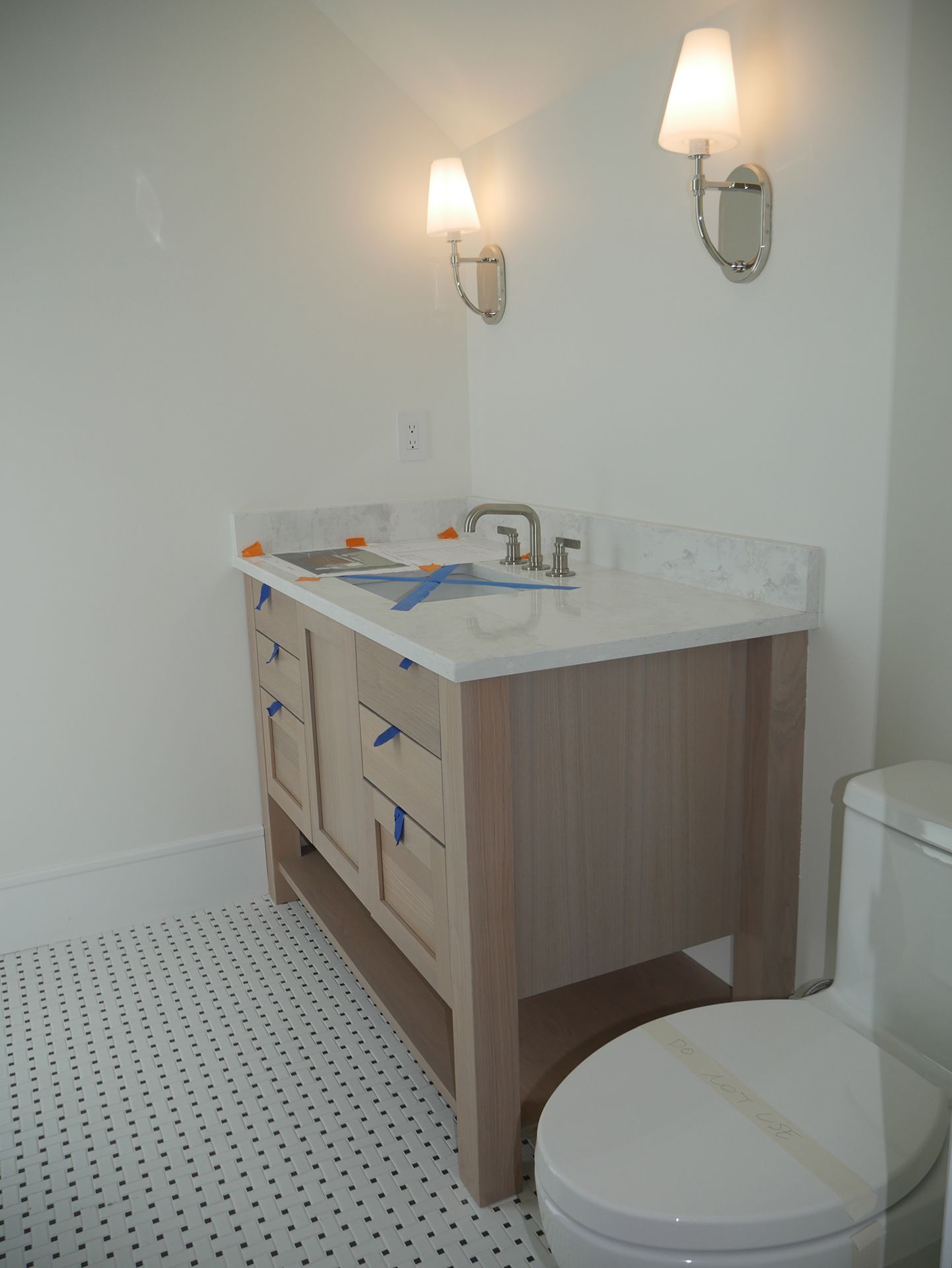 A bathroom with a toilet and sink