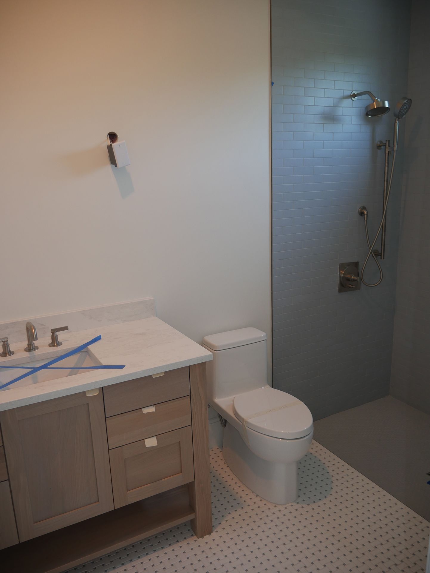 A new bathroom with a toilet, sink, and shower