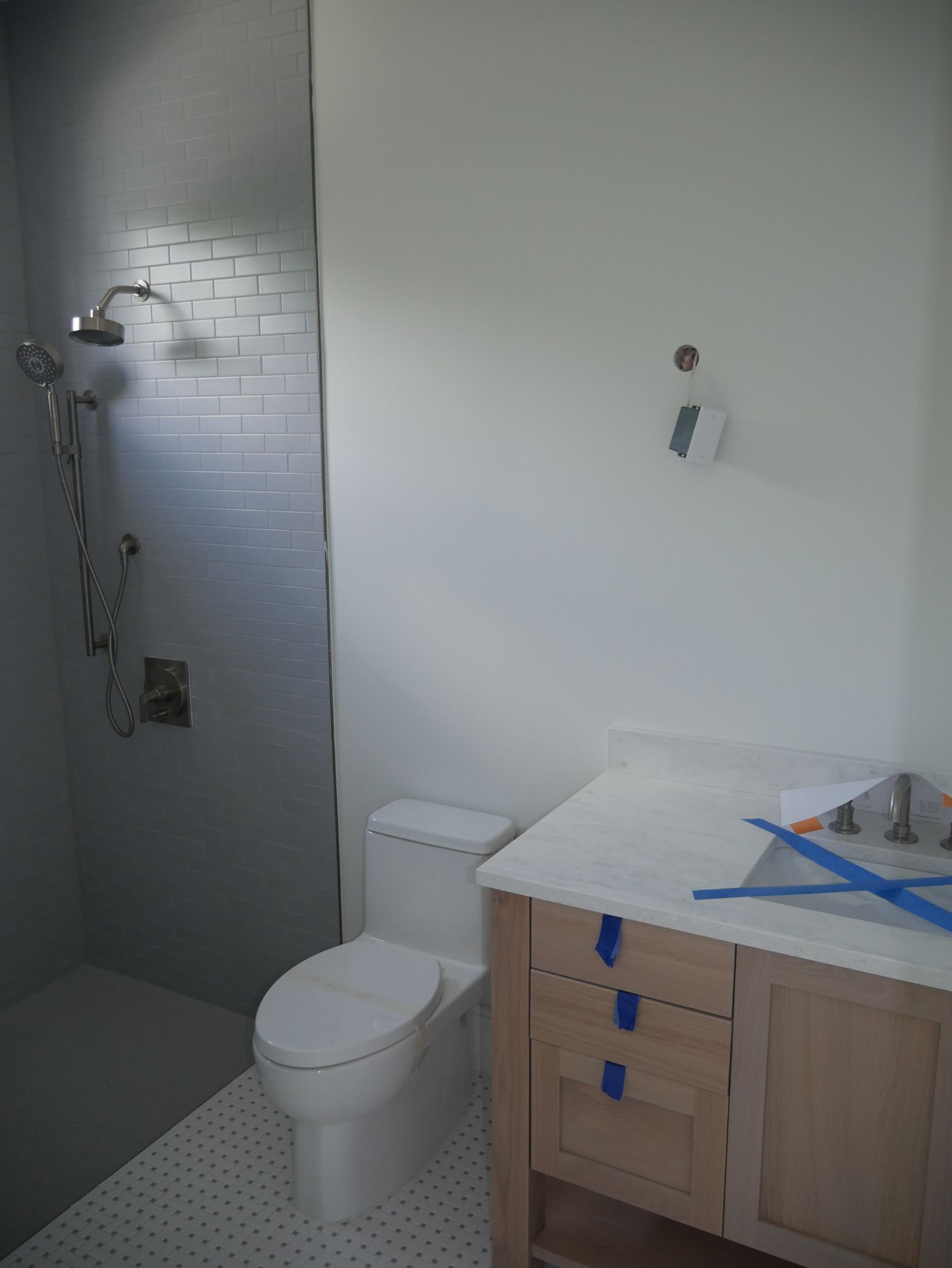 Shower on the left and toilet to the right