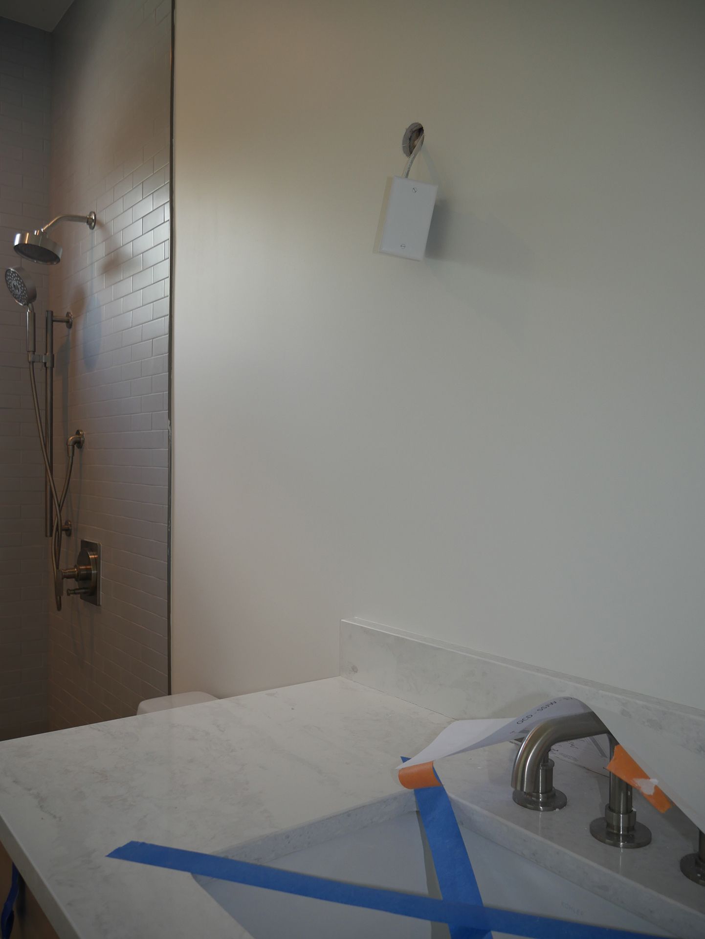 Blue tape covering the new sink