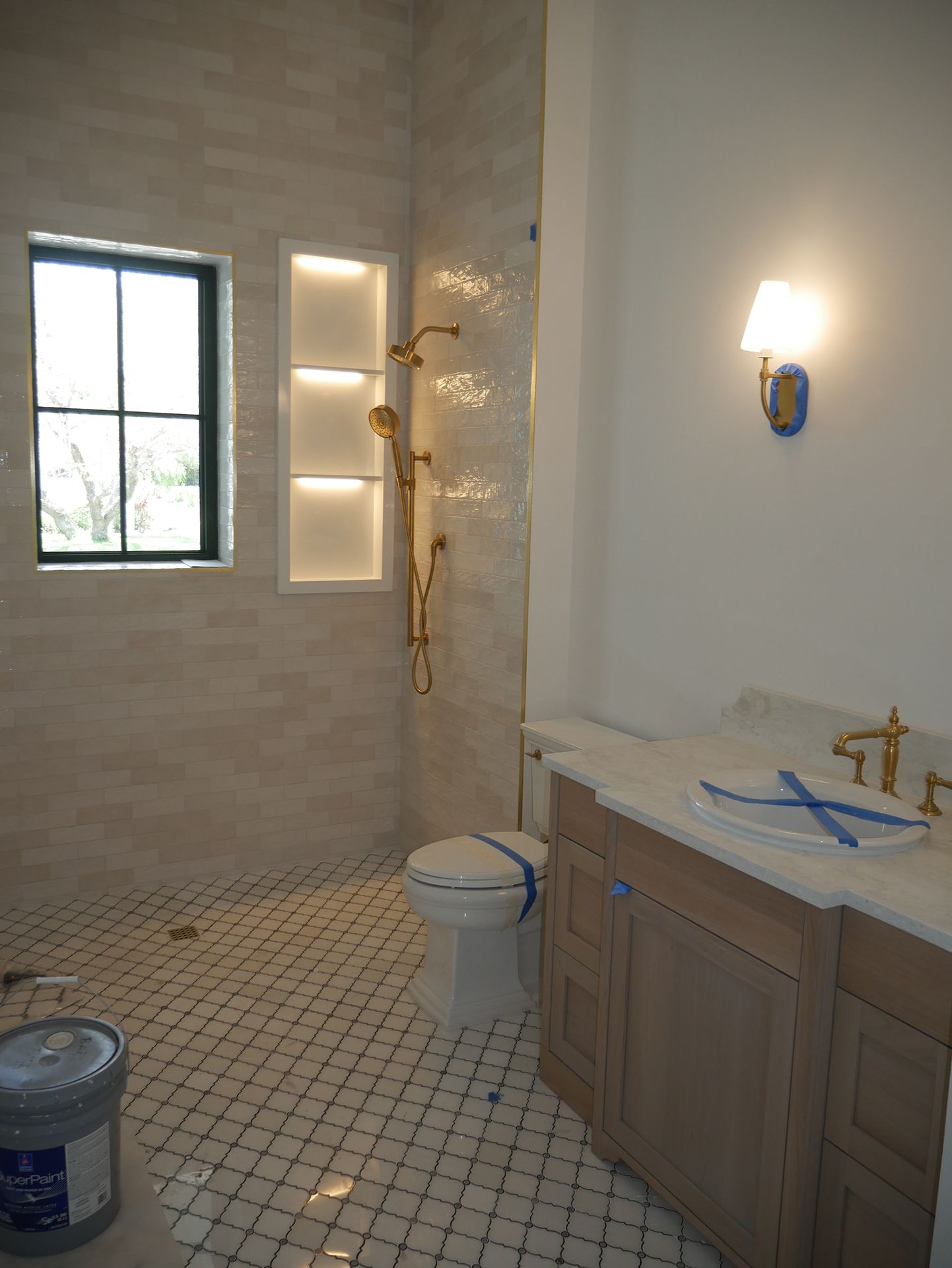 Shower with gold shower head and fixtures