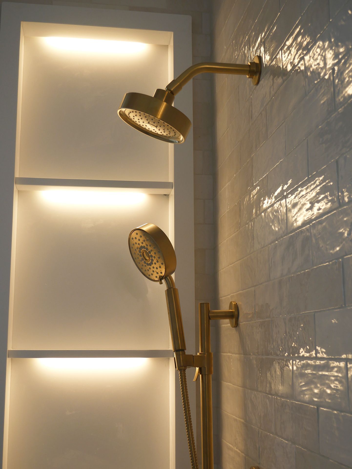 Close up of two gold shower heads