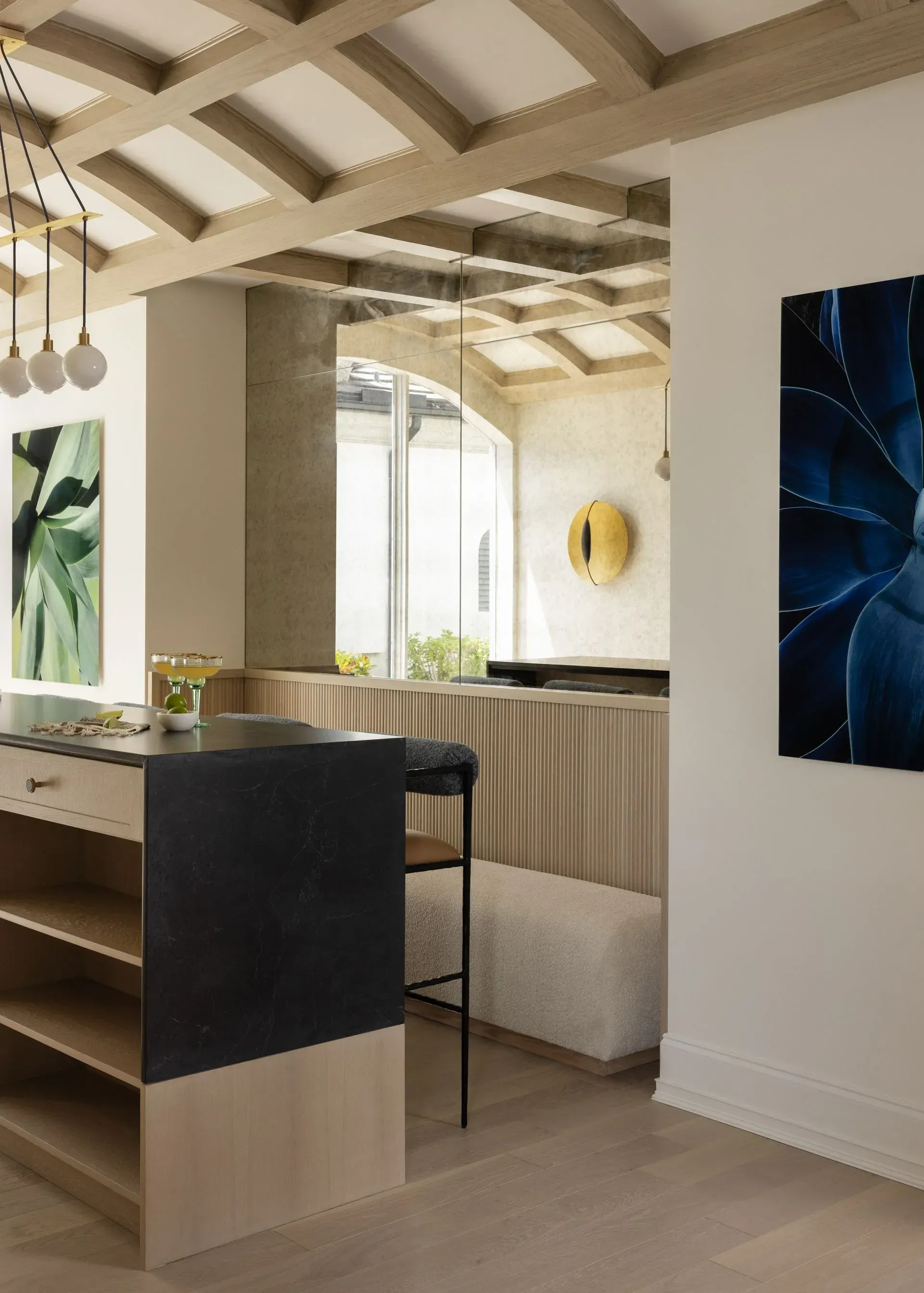 A wine room with a bar and a painting on the wall