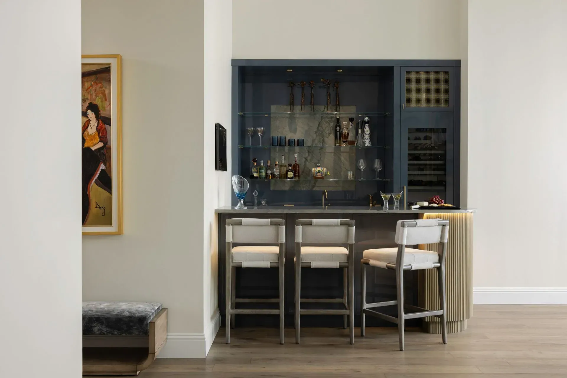 A living room with a large flat screen tv on the wall