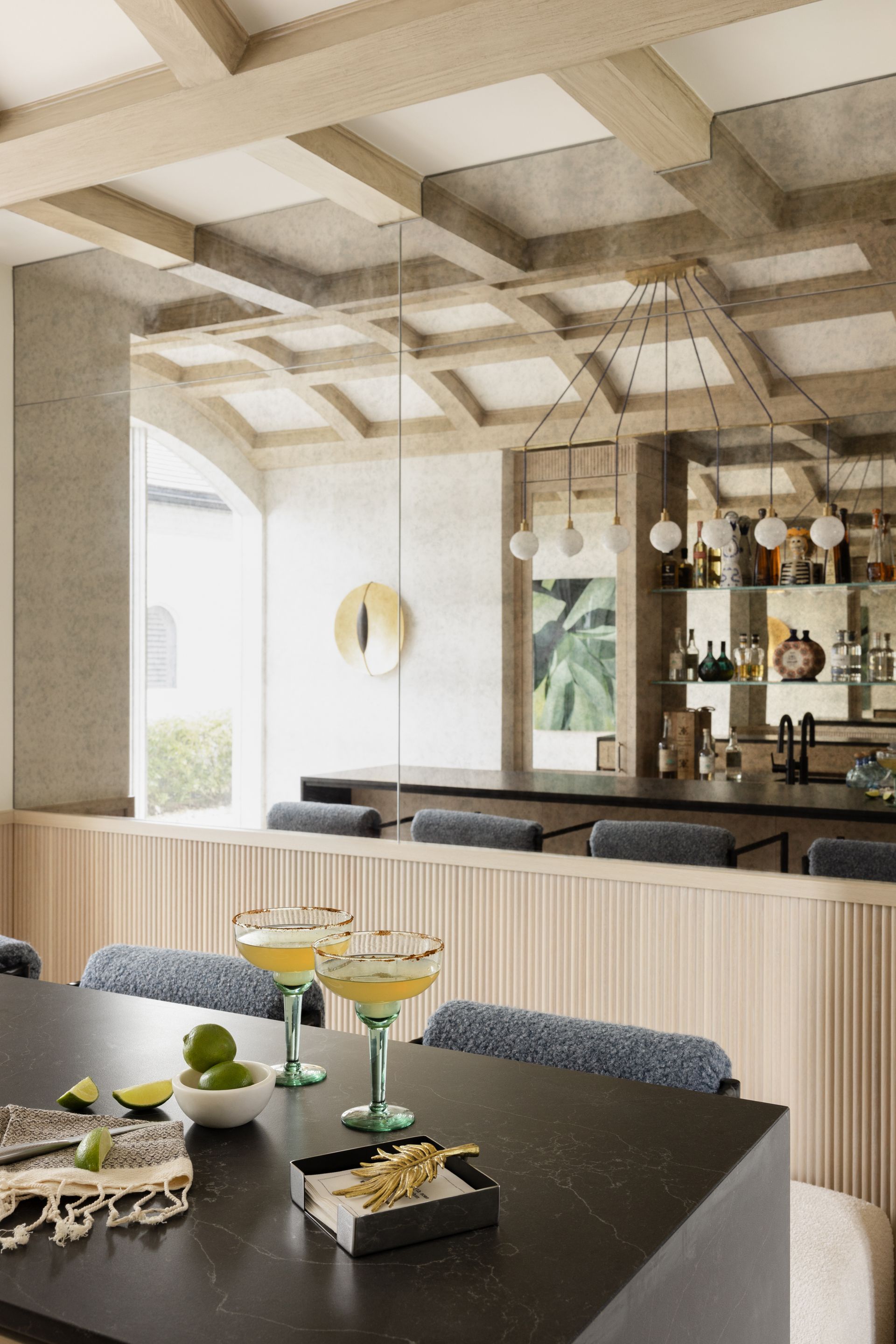 A table with two martini glasses on it in a restaurant.