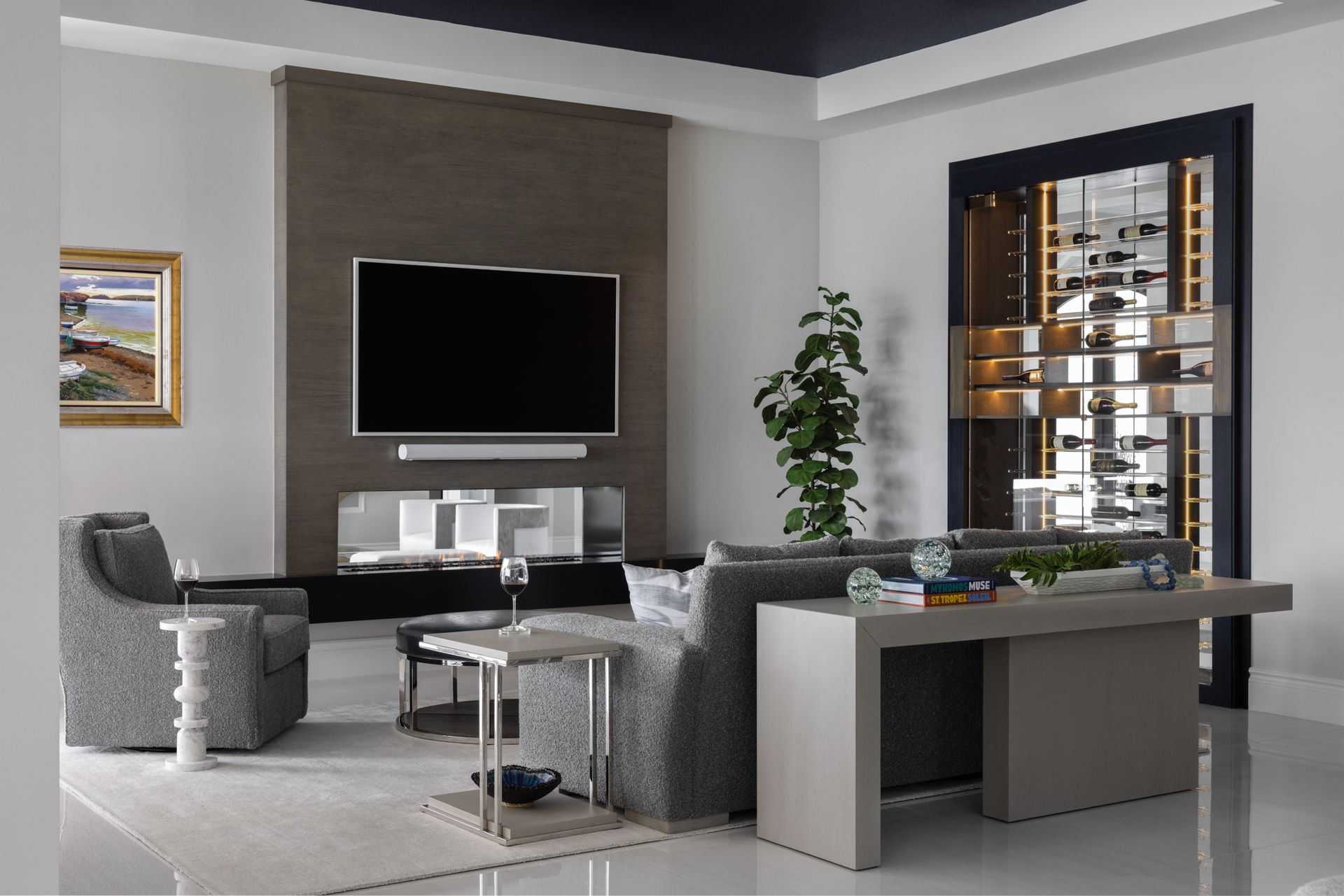 A living room with a large flat screen tv on the wall