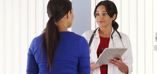 Female doctor consulting patient