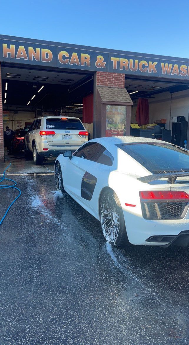 Queue of cars in a car washing station