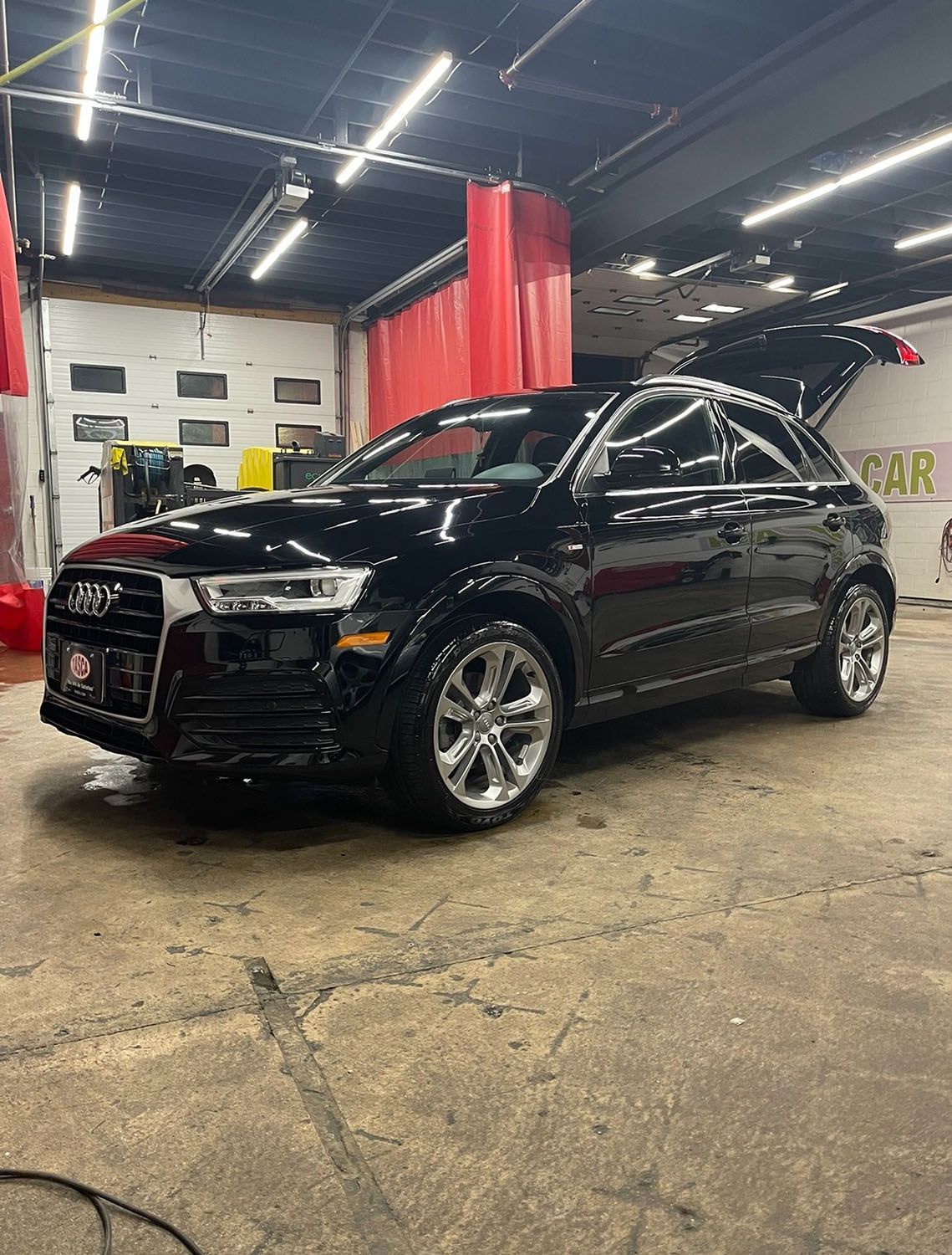 Vehicle in a car washing station