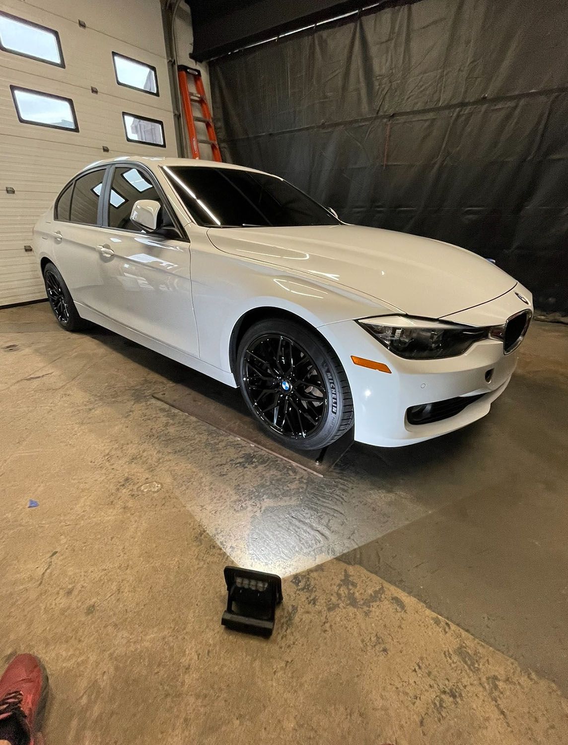 Vehicle inside a car washing station