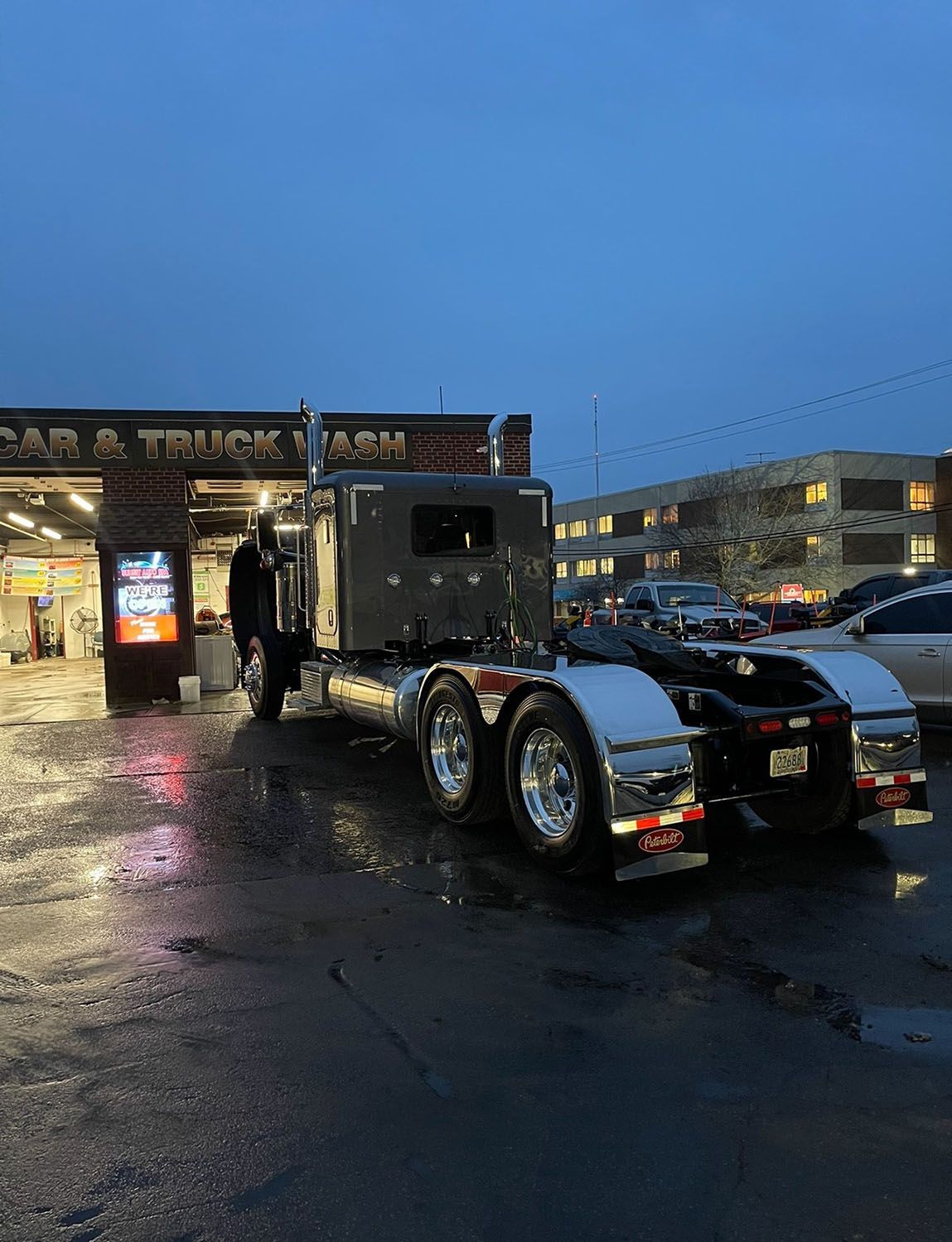 Heavy duty truck outside a car washing station