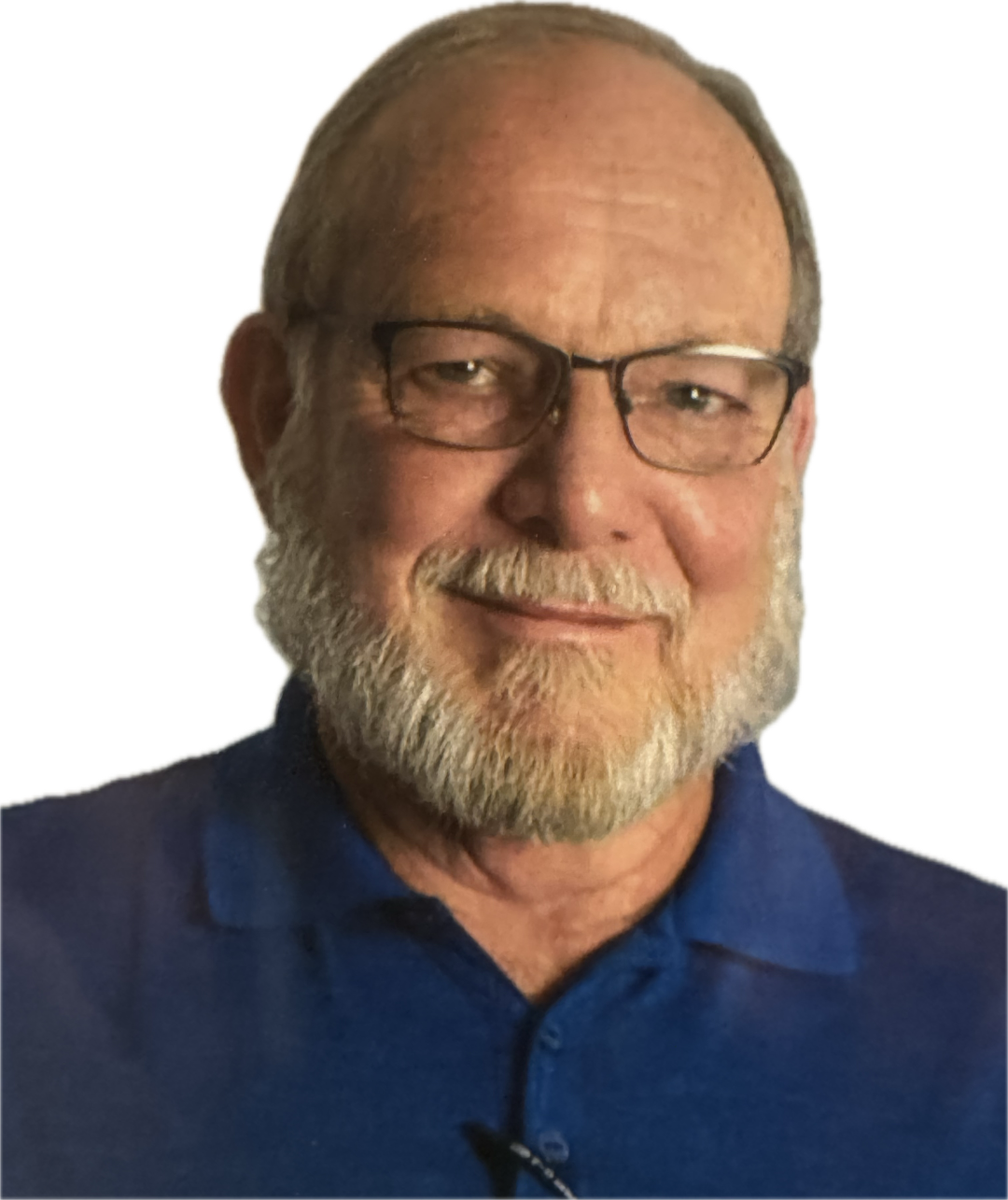 Older man with glasses and a white beard wearing a blue polo shirt, smiling.
