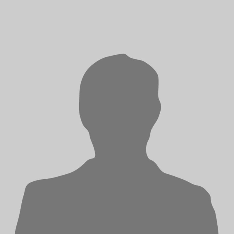 A silhouette of a man without a face on a gray background.