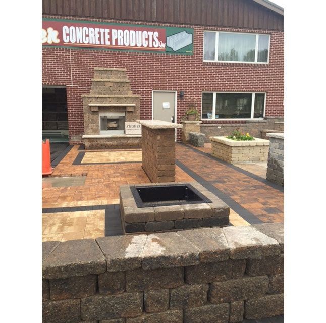 A brick building with a sign that says concrete products